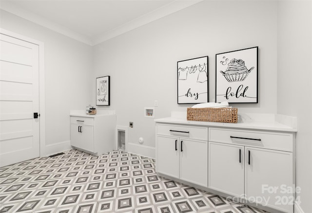 laundry area with electric dryer hookup, cabinets, ornamental molding, and hookup for a washing machine