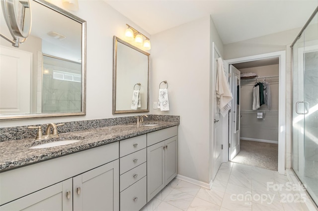 bathroom with vanity and walk in shower