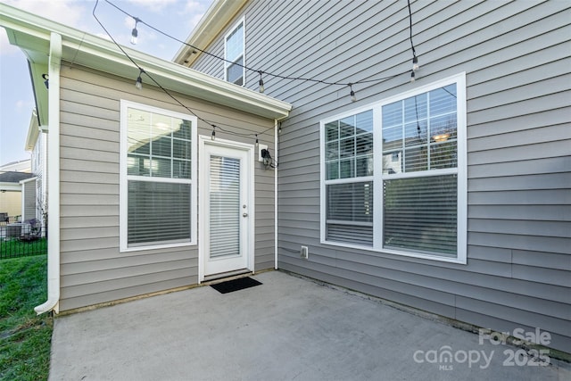 entrance to property with a patio area