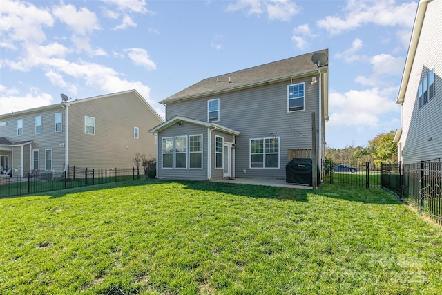 back of property featuring a yard and a patio area