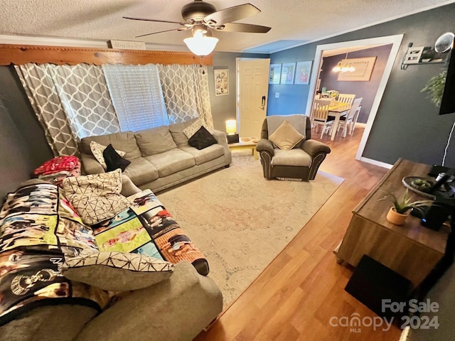 940 Devil Track Rd, Taylorsville, NC 28681 - living area featuring ceiling fan, wood finished floors, a textured ceiling, and baseboards