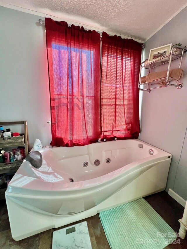 940 Devil Track Rd, Taylorsville, NC 28681 - full bath featuring a textured ceiling and a jetted tub