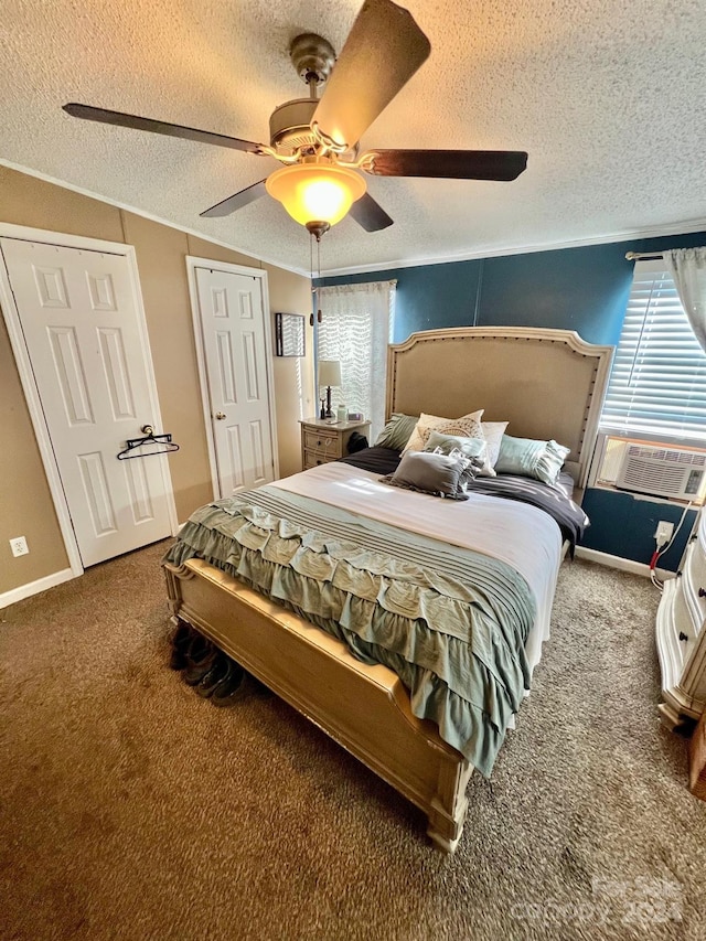 bedroom with carpet, a textured ceiling, ceiling fan, and cooling unit