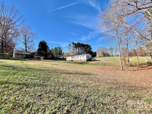 view of yard with a rural view