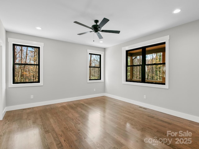 unfurnished room featuring wood-type flooring and ceiling fan