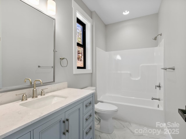 full bathroom featuring vanity,  shower combination, and toilet