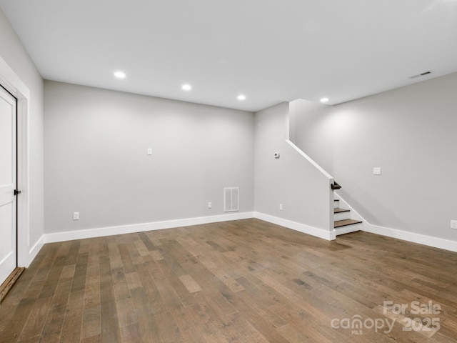 basement with hardwood / wood-style floors