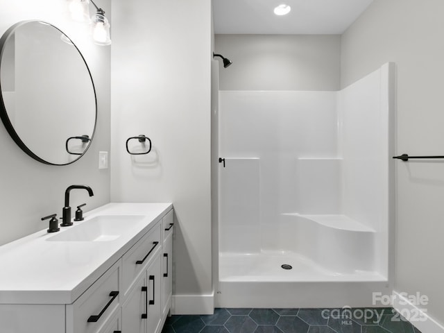 bathroom with vanity, tile patterned floors, and walk in shower