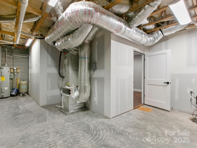 basement featuring electric water heater and heating unit