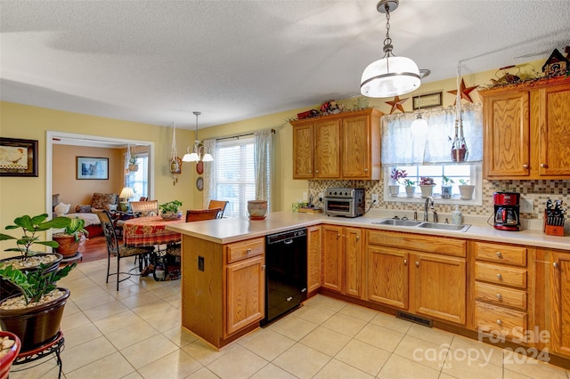 kitchen with kitchen peninsula, backsplash, sink, black dishwasher, and hanging light fixtures