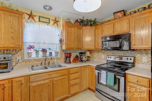 kitchen featuring electric range, sink, pendant lighting, a textured ceiling, and light tile patterned floors