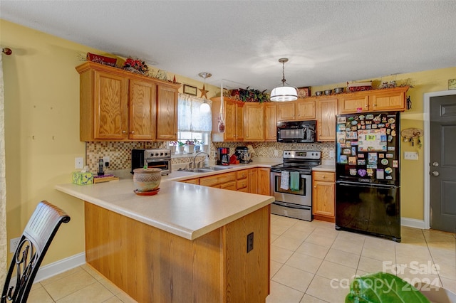 kitchen with kitchen peninsula, sink, black appliances, and decorative light fixtures