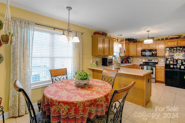 tiled dining room with sink, a healthy amount of sunlight, and an inviting chandelier