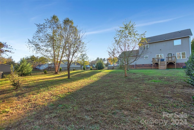 view of yard with a wooden deck