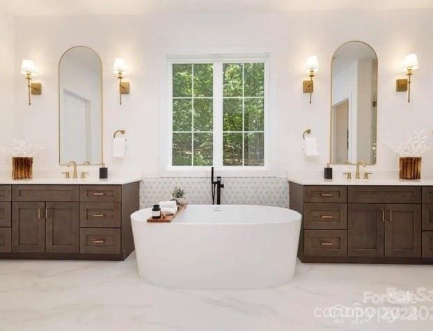 bathroom featuring a bathing tub and vanity