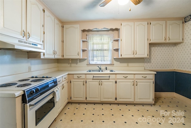 kitchen with white electric range oven, ceiling fan, and sink