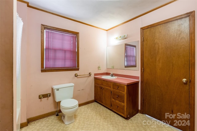 bathroom with a shower with curtain, vanity, toilet, and crown molding