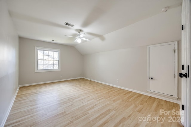 bonus room featuring light hardwood / wood-style flooring, vaulted ceiling, and ceiling fan