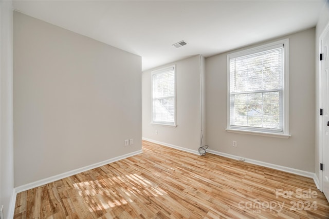 unfurnished room featuring light wood-type flooring