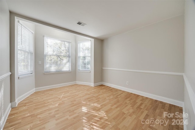 unfurnished room featuring light hardwood / wood-style floors