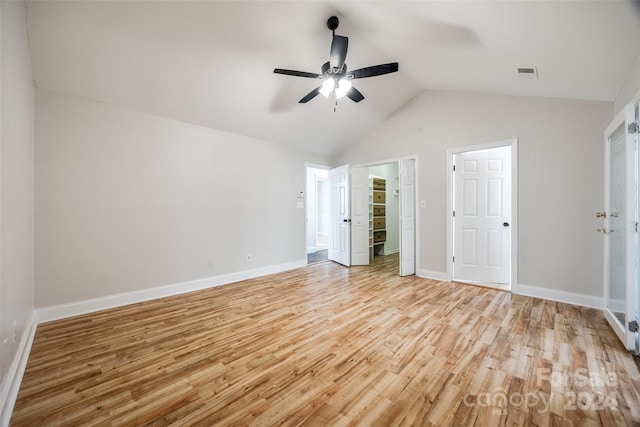 unfurnished bedroom with light hardwood / wood-style floors, ceiling fan, and lofted ceiling