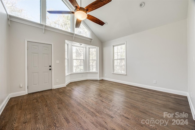 interior space with high vaulted ceiling, dark hardwood / wood-style floors, and a wealth of natural light