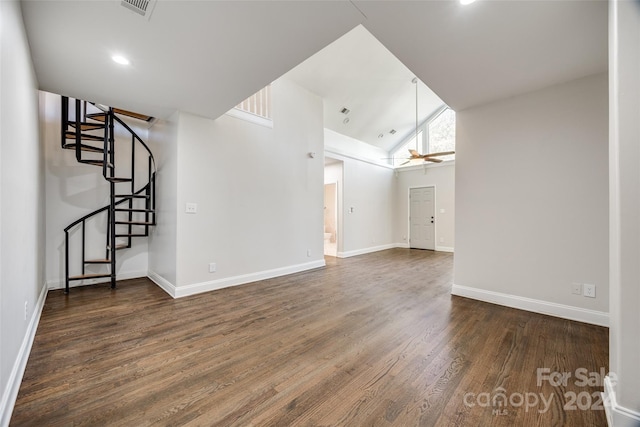 unfurnished living room with a wealth of natural light, ceiling fan, high vaulted ceiling, and dark hardwood / wood-style floors