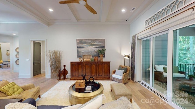 living room with beamed ceiling, light wood-type flooring, ceiling fan, and ornamental molding