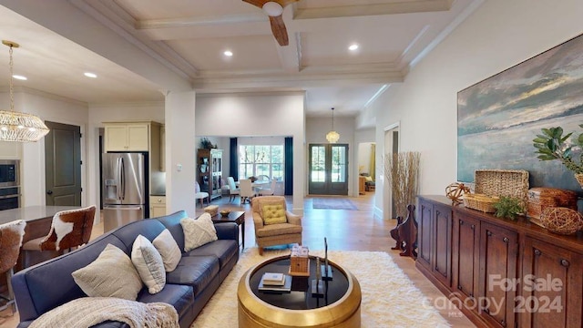 living room with beamed ceiling, ornamental molding, light hardwood / wood-style floors, and coffered ceiling