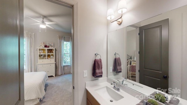 bathroom with ceiling fan and vanity