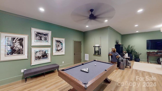 rec room featuring ceiling fan, light hardwood / wood-style floors, ornamental molding, and billiards