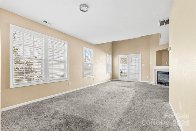 unfurnished living room with carpet