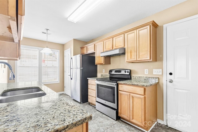 kitchen with sink, light brown cabinetry, appliances with stainless steel finishes, decorative light fixtures, and light stone counters