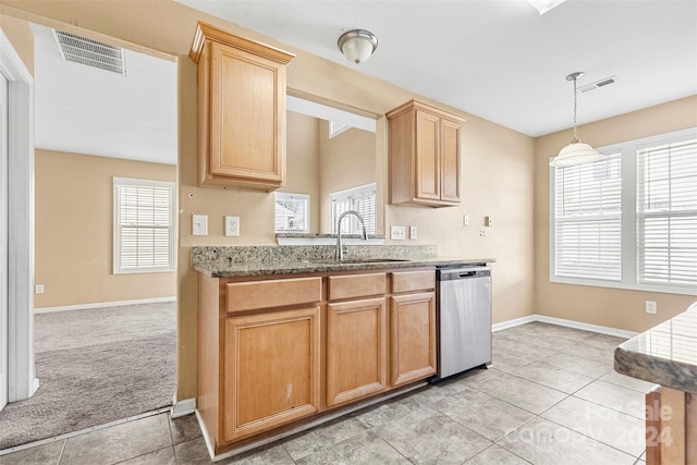 kitchen with dishwasher, light brown cabinets, sink, pendant lighting, and light colored carpet