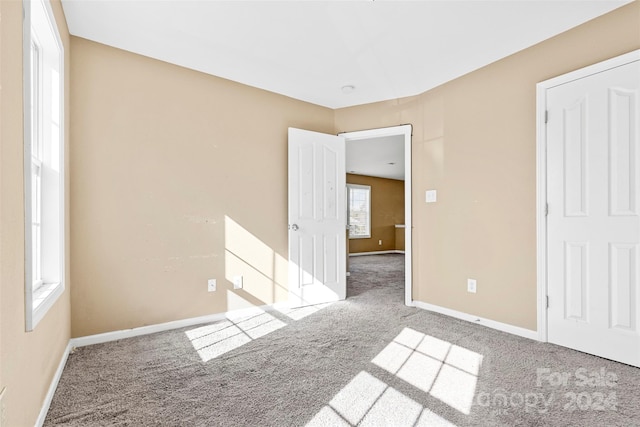 unfurnished bedroom with carpet