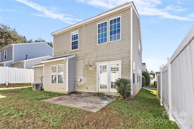 back of house with a yard, a patio, and central AC unit