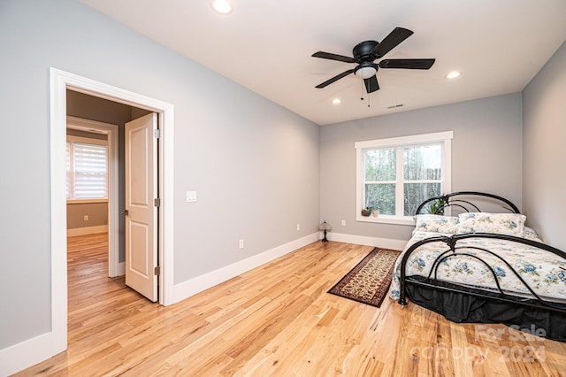 bedroom featuring light hardwood / wood-style flooring and ceiling fan