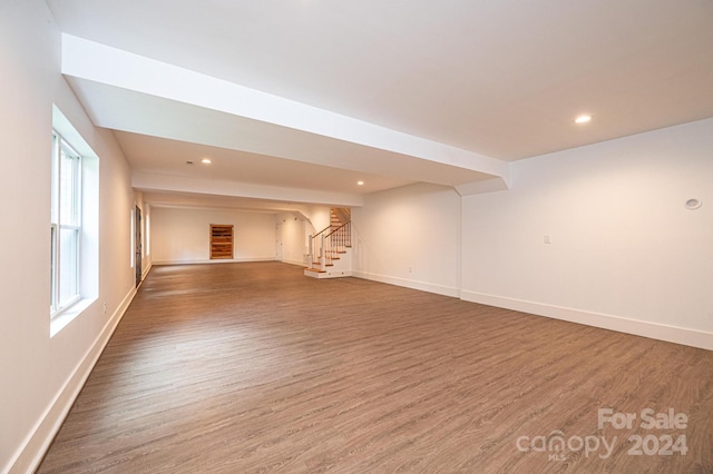 unfurnished room featuring dark wood-type flooring