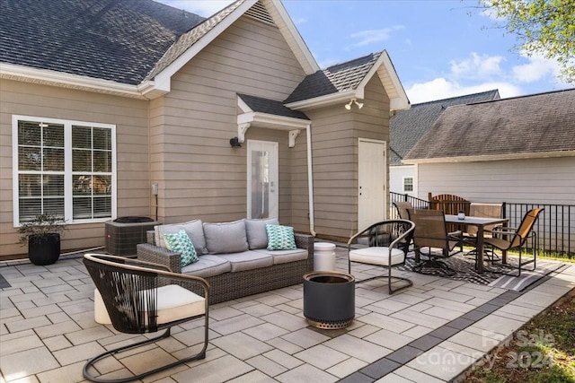 view of patio / terrace with central AC unit and an outdoor hangout area