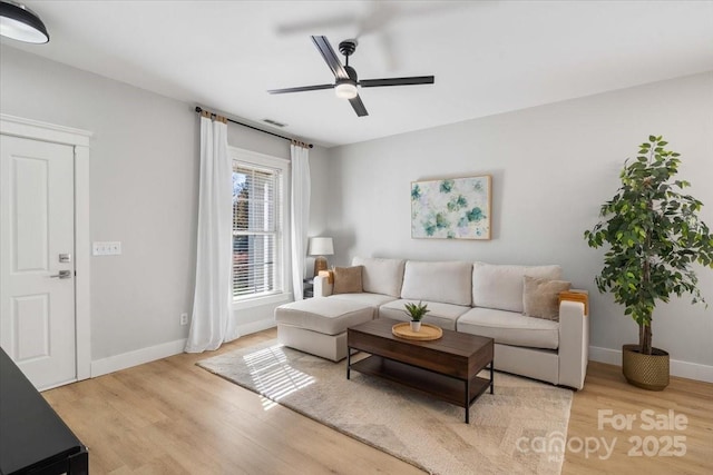8225 Ballymore Ct, Huntersville, NC 28078 - living area with a ceiling fan, light wood-style flooring, and baseboards