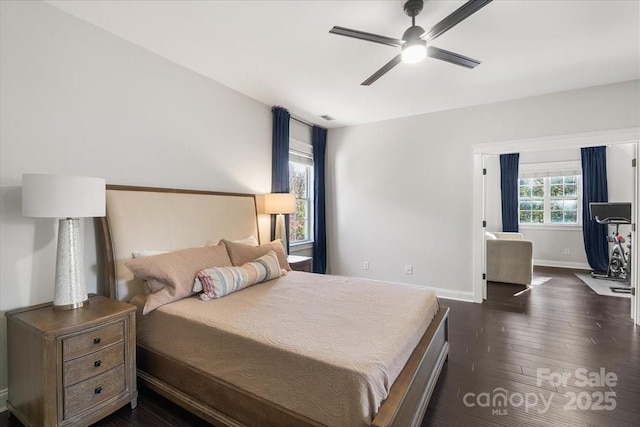 8225 Ballymore Ct, Huntersville, NC 28078 - bedroom featuring dark wood finished floors, baseboards, and ceiling fan