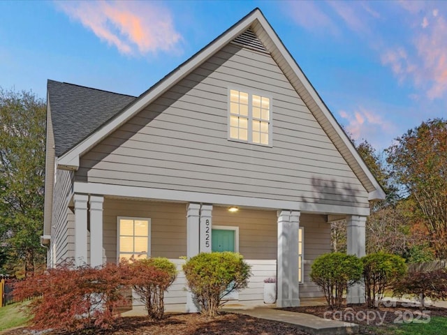 8225 Ballymore Ct, Huntersville, NC 28078 - view of front facade with covered porch and roof with shingles