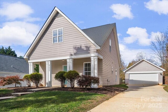 8225 Ballymore Ct, Huntersville, NC 28078 - view of front of home with an outbuilding, a porch, a detached garage, and a front yard