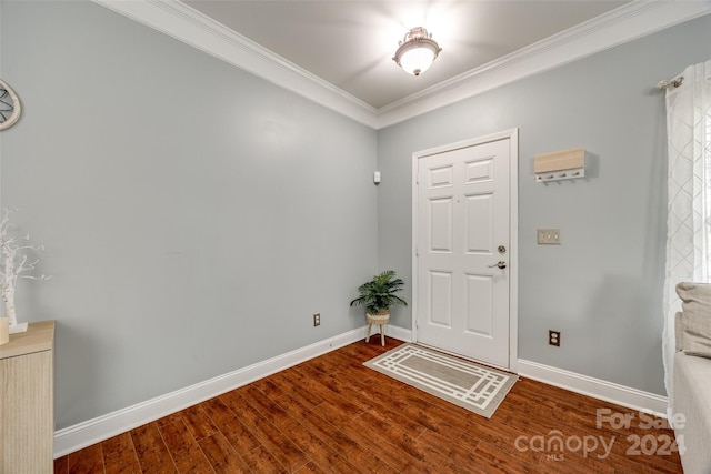 foyer entrance with hardwood / wood-style floors and crown molding