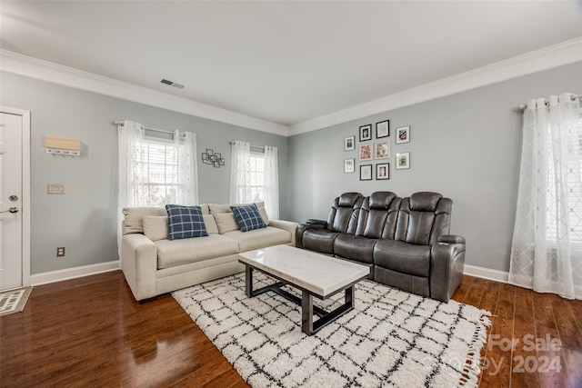 living room featuring dark hardwood / wood-style floors and crown molding