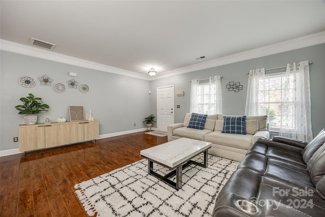 living room with hardwood / wood-style flooring and crown molding