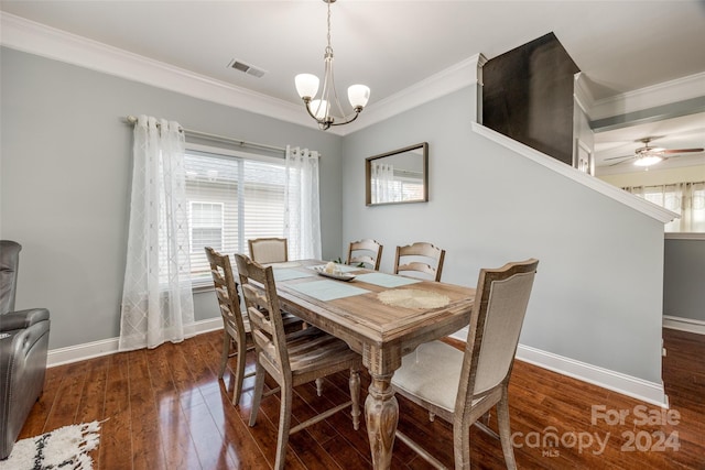 dining area with dark hardwood / wood-style floors, ceiling fan with notable chandelier, crown molding, and a wealth of natural light