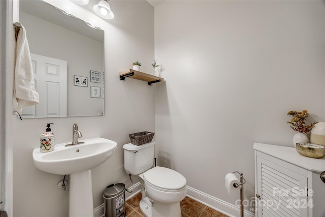 bathroom with tile patterned floors and toilet