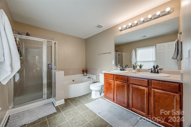 full bathroom featuring tile patterned floors, vanity, independent shower and bath, and toilet