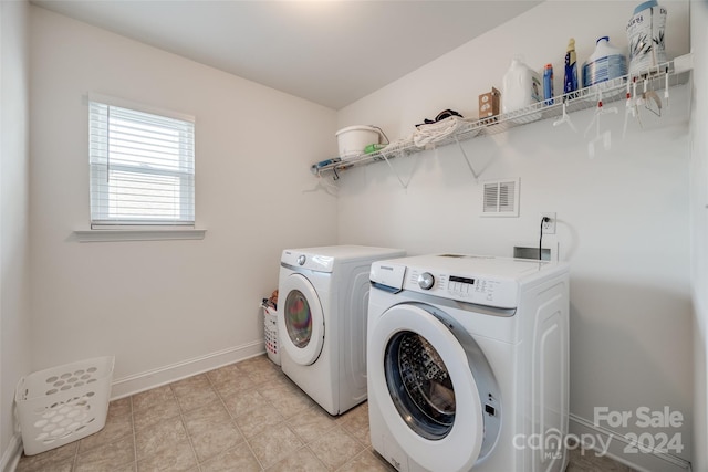 washroom featuring washing machine and dryer